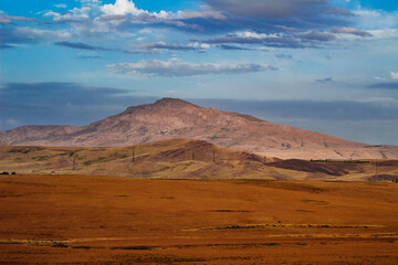 Fototapeta na wymiar amazing mountain peak kazygurt under blue sky 