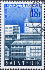 France - circa 1958: a postage stamp from France , showing the city view of Saint-Die