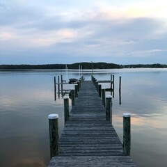 Waterfront landscapes in Piney Point, Maryland with beautiful sunrises, sunsets, and a golden doodle.  