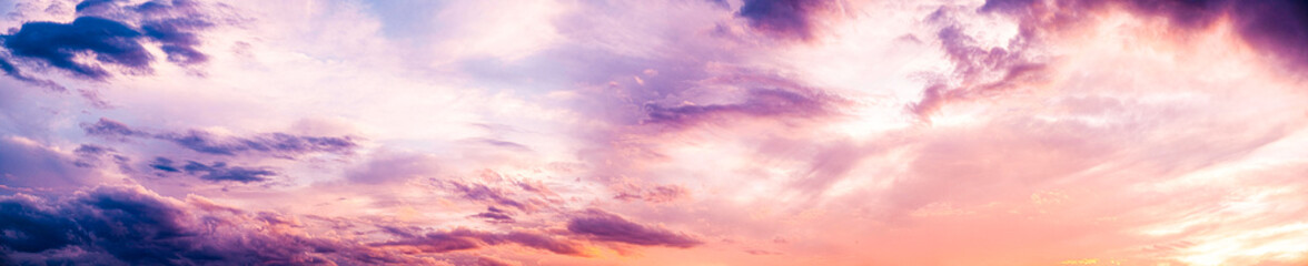 Dark blue sunset sky pano with Cumulus clouds. Sky background