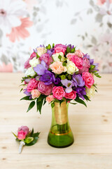 wedding bridal bouquet of roses and freesias 