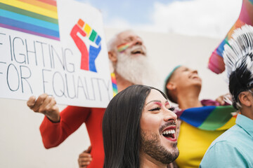 Gay and transgender people protest at lgbt pride event for equality rights outdoor - Focus on drag...