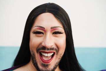 Portrait of happy drag queen looking at camera - Focus on nose