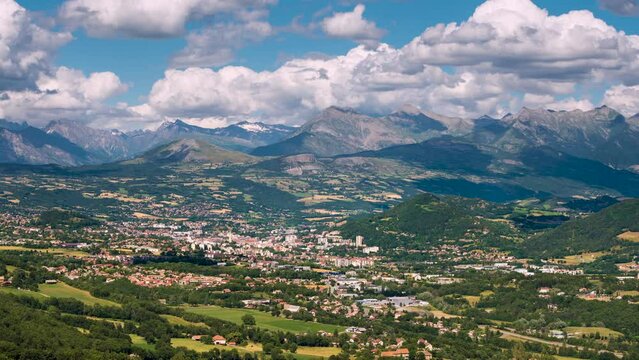 Timelapse of the city of Gap in Summer with view of the Champsaur and Ecrins National Park mountain range in the distance. Hautes-Alpes (French Alps), France