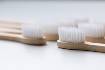 Set of ECO friendly wooden bamboo toothbrushes. Save the planet or NO plastic concept. Isolated on white background.