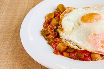 Manchego ratatouille dish with fried egg