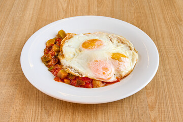 Manchego ratatouille dish with fried egg