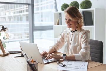 Young caucasian business woman working at office