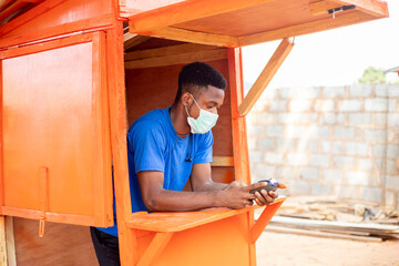 african Businessman using pos terminal in a local shop