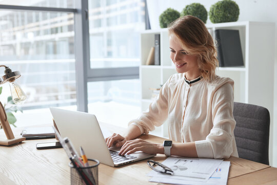 Young caucasian business woman working at office - Powered by Adobe