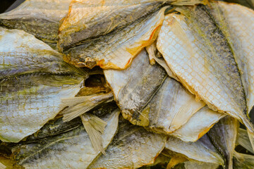 Dried salted yellow-striped selar. Salty fish snack.