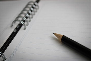 pencil on notebook