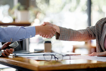 Close up Business handshake for teamwork of business merger and acquisition,successful negotiate,hand shake,two businessman shake hand with partner to celebration partnership and business deal concept