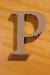 A solid p carved out of wood