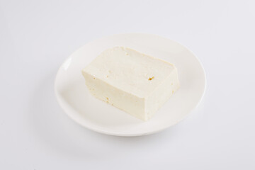 tofu cheese on a white plate on a white background