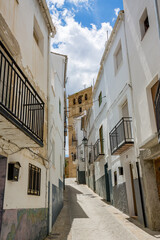 Fototapeta na wymiar Homes. Alhama de Granada, Andalusia, Spain. Beautiful and interesting travel destination in the warm Southern region. Public street view.