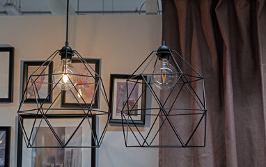 Black metal lamps with filament light lamps in loft style.