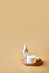 Face and body care concept, bottles of creams, lotions, serums