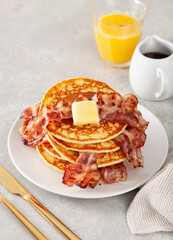 sweet pancakes with butter and bacon. traditional american breakfast