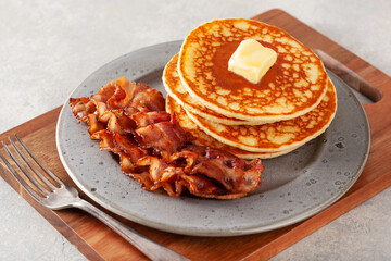 sweet pancakes with butter and bacon. traditional american breakfast