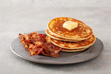 sweet pancakes with butter and bacon. traditional american breakfast