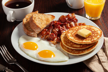 traditional full american breakfast eggs pancakes with bacon and toast - Powered by Adobe