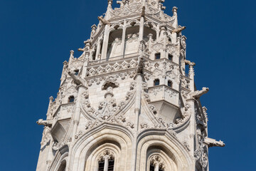 Saint Matthias Church tower in gothic architecture with gargoyles against blue sky, Budapest,...