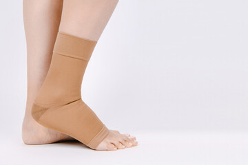 Orthopedic Ankle Brace. Medical Ankle Bandage. Medical Ankle Support Strap Adjustable Wrap Bandage Brace foot Pain Relief Sport. Leg Brace isolated on white background. Trauma Ankle orthosis. Injury.