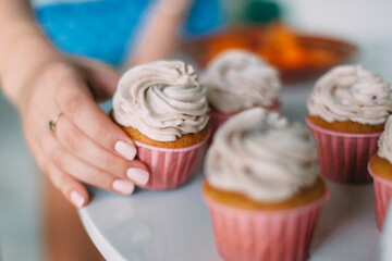 the girl cooks cakes in a beautiful bright kitchen in blue tones