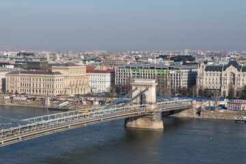 Fototapeta na wymiar Cityscape of budapest with Szechenyi chain bridge over Danube river under renovation