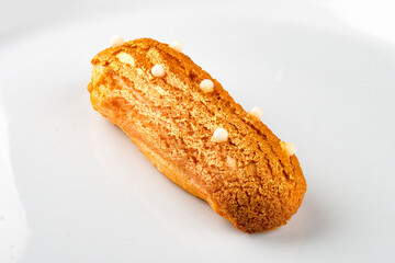 Eclair. Custard cake with buttercream.
