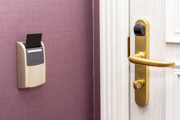 Modern door room with card key in hotel room