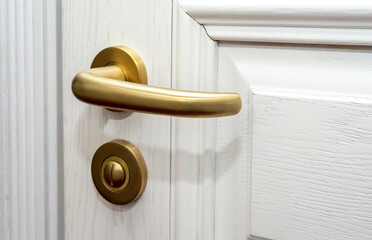Old rustic wooden white door detail with door handle