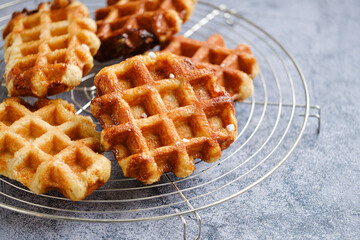 Homemade Belgian Waffles from the city of Liege on round steel trivet