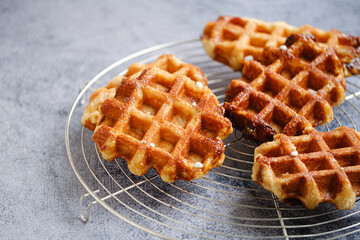 Homemade Belgian Waffles from the city of Liege on round steel trivet