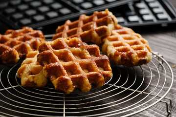Homemade Belgian Waffles from the city of Liege on round steel trivet