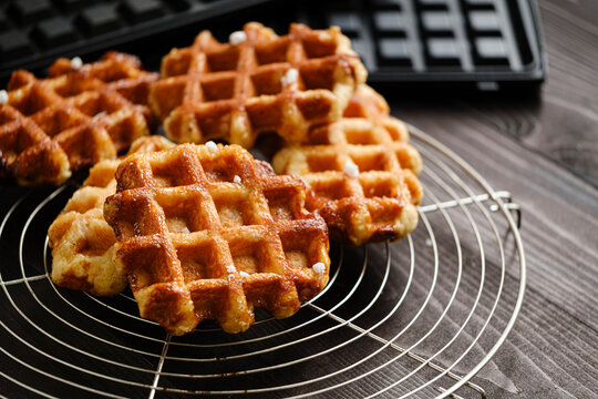 Homemade Belgian Waffles from the city of Liege on round steel trivet
