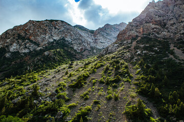 mountain gorge under sky with clouds