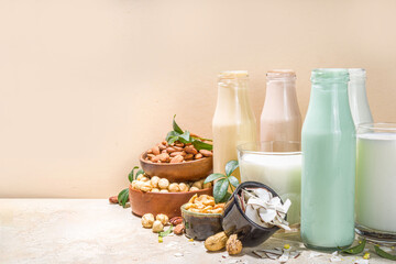 keto, paleo and vegan diet concept. Set of nut milks, bottles with various non-dairy nut milk -...