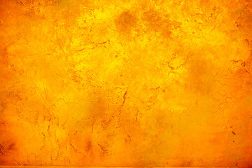 Background wall with abstract spots. Beautiful golden texture with stains, abstract surface background, modern bright painting of walls in trending shades, unusual spotty silver and gold surface.