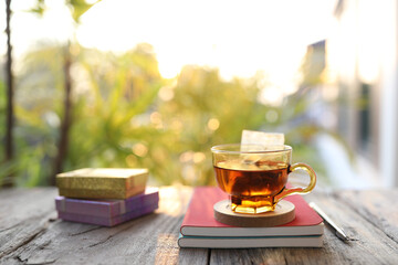 Tea in a glass cup and notebook and gift box