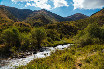 mountain gorge under sky with clouds