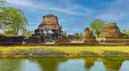 Fototapeta na wymiar Sukhothai historical park, Wat Mahathat ruins. One of most beautiful and worth seen place in Thailand. Popular travel destination while visiting southeast Asia.