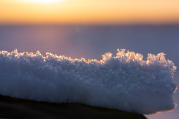 Snowball close-up. Snow at sunset.The concept of winter and cold - 486074354