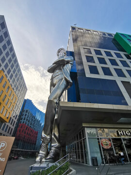 Pasay, Metro Manila, Philippines - Feb 2022: A giant steel statue leans at the entrance of DoubleDragon Meridian Park.