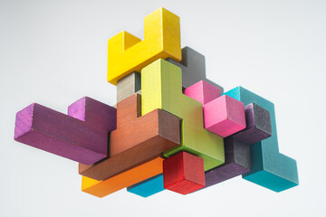 Abstract construction from wooden blocks. The concept of logical thinking..