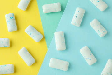 Chewing or bubble gum on multicolored background