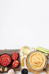 Fototapeta na wymiar Concept of tasty food with hummus on white background