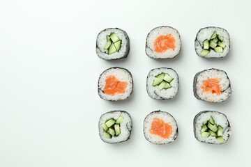 Concept of tasty food with sushi rolls on white background © Atlas