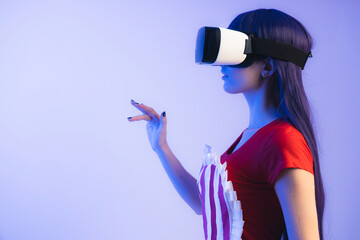 Waitress in apron using VR headset goggles and virtual interface with hand gestures. High quality...